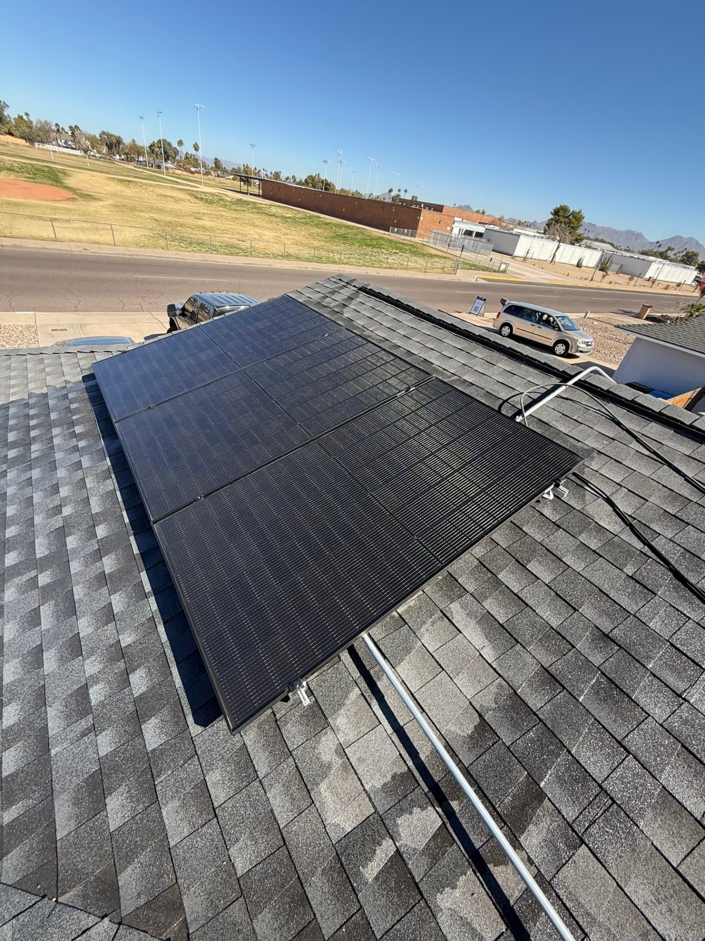 Cleaned solar panels on a shingle roof
